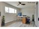 Bright home office with gray wood floors, large window, and modern desk and decor at 1400 Cottonwood Pl, Las Vegas, NV 89104