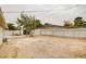 Spacious backyard with mature trees, a fence, and an open space for entertaining at 1804 David Ave, Las Vegas, NV 89101
