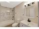 Stylish bathroom featuring marble tile, a shower-tub combo, and vanity with sink at 1804 David Ave, Las Vegas, NV 89101