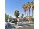 Cozy single-story home with mature trees, a driveway, and white fence at 1804 David Ave, Las Vegas, NV 89101