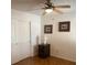 Bedroom featuring a ceiling fan and a small desk with drawers, creating a comfortable and functional space at 2260 Rugged Mesa Dr, Laughlin, NV 89029