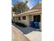 Exterior view of home features a sidewalk, neutral color palette and two blue trash cans at 2260 Rugged Mesa Dr, Laughlin, NV 89029