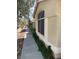 Charming house featuring a landscaped pathway with lush greenery and stone accents, creating a welcoming entrance at 2260 Rugged Mesa Dr, Laughlin, NV 89029