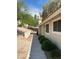 Exterior view of home features a sidewalk with desert landscaping, light post and neutral color palette at 2260 Rugged Mesa Dr, Laughlin, NV 89029