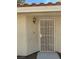The front entrance of the home is protected with a screen door at 2260 Rugged Mesa Dr, Laughlin, NV 89029