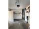 View of the home's garage including shelves, a hot water heater, and access door at 2260 Rugged Mesa Dr, Laughlin, NV 89029