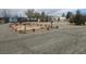 A gravel lot with a framed area and several mobile homes in the background on an overcast day at 2341 Shady Ln, Pahrump, NV 89060