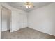 This bedroom features neutral carpet, ceiling fan, and closet at 2649 Heathrow St, Las Vegas, NV 89135