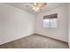 This bedroom features a ceiling fan and a window with privacy blinds at 2649 Heathrow St, Las Vegas, NV 89135
