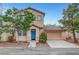 Charming two-story home featuring a blue front door and attached two car garage at 2649 Heathrow St, Las Vegas, NV 89135