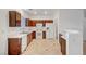 Well-lit kitchen featuring wood cabinets, white appliances, and ample counter space at 2649 Heathrow St, Las Vegas, NV 89135