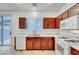 Well-lit kitchen features wooden cabinets, white countertops, and modern appliances at 2649 Heathrow St, Las Vegas, NV 89135