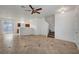 Spacious living area showcasing tile floors, staircase, and an open layout to the kitchen at 2649 Heathrow St, Las Vegas, NV 89135