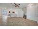 Spacious living area showcasing tile floors, staircase, and an open layout to the kitchen at 2649 Heathrow St, Las Vegas, NV 89135