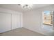 Bright bedroom features neutral carpet, closet with sliding doors, and natural light from a window at 2727 Scotch Heather St, Las Vegas, NV 89142