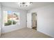 Neutral carpet and white walls brighten the airy bedroom with natural light streaming through the window at 2727 Scotch Heather St, Las Vegas, NV 89142
