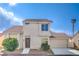 Charming two-story home with a well-maintained front yard and a two car garage at 2727 Scotch Heather St, Las Vegas, NV 89142