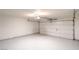 Spacious two-car garage features epoxy flooring, automatic door, and ample space for vehicles and storage at 2727 Scotch Heather St, Las Vegas, NV 89142
