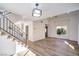 Bright living room with modern staircase and luxury wood flooring at 2727 Scotch Heather St, Las Vegas, NV 89142