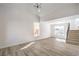 Open-concept living area with modern fixtures and luxury wood flooring at 2727 Scotch Heather St, Las Vegas, NV 89142