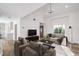 Bright living room with modern furniture, vaulted ceiling and luxury wood flooring at 2727 Scotch Heather St, Las Vegas, NV 89142