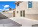 This home features a private backyard patio with concrete flooring and block wall fencing at 2727 Scotch Heather St, Las Vegas, NV 89142