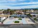Wide aerial view of a renovated home in a tranquil neighborhood with desert landscaping and curved driveway at 2749 Horseshoe Dr, Las Vegas, NV 89120