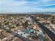Expansive aerial view of a neighborhood with a renovated home, showcasing its proximity to city amenities at 2749 Horseshoe Dr, Las Vegas, NV 89120