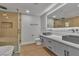 Bathroom with double sink vanity, glass shower, and modern fixtures at 2749 Horseshoe Dr, Las Vegas, NV 89120