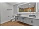 Bathroom featuring dual sinks, modern fixtures, and stylish cabinetry at 2749 Horseshoe Dr, Las Vegas, NV 89120