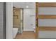 Modern bathroom with a glass shower, soaking tub, toilet and a sliding glass door at 2749 Horseshoe Dr, Las Vegas, NV 89120