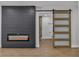 Bedroom features a modern fireplace and access to a bathroom with a sliding glass door at 2749 Horseshoe Dr, Las Vegas, NV 89120