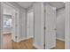 Hallway with neutral walls and flooring, showcasing multiple doorways for easy access throughout the home at 2749 Horseshoe Dr, Las Vegas, NV 89120