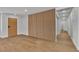 Living space with laminate flooring and modern accent wall at 2749 Horseshoe Dr, Las Vegas, NV 89120