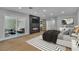 Bright primary bedroom featuring a fireplace, TV, and sliding glass doors at 2749 Horseshoe Dr, Las Vegas, NV 89120
