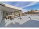 Covered patio with a dining table and view of the pool and backyard at 2749 Horseshoe Dr, Las Vegas, NV 89120