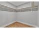 Walk-in closet with shelving and hardwood flooring at 2749 Horseshoe Dr, Las Vegas, NV 89120