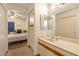 Bathroom featuring a large vanity with sink, mirror, and toilet visible through doorway at 2819 Prickley Pear Dr, Henderson, NV 89074