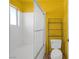 Yellow bathroom with a walk-in shower, clear sliding shower door and built in shelving at 2819 Prickley Pear Dr, Henderson, NV 89074