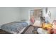 Bright bedroom with a whimsical comforter, large window, and a work desk at 2819 Prickley Pear Dr, Henderson, NV 89074