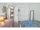Bright bedroom with a whimsical comforter and a closet with sliding doors at 2819 Prickley Pear Dr, Henderson, NV 89074