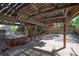 Backyard with hot tub on a wooden deck under a pergola, and gravel tiered seating area at 2819 Prickley Pear Dr, Henderson, NV 89074