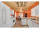 Bright eat-in kitchen with white appliances, and ample natural light at 2819 Prickley Pear Dr, Henderson, NV 89074