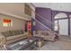 Inviting living room with tile flooring, a staircase, neutral furniture, and stylish decor at 2819 Prickley Pear Dr, Henderson, NV 89074