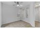 Bright, empty bedroom with neutral walls, tile floors, ceiling fan, and natural light at 2975 Bluegrass Ln # 811, Henderson, NV 89074