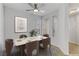 Elegant dining room with neutral tones, stylish furnishings, and a large window at 2975 Bluegrass Ln # 811, Henderson, NV 89074
