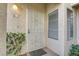 Front door with security gate, decorative window, and neutral exterior at 2975 Bluegrass Ln # 811, Henderson, NV 89074