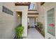 Front entrance features security gate, decorative window, and well maintained landscape at 2975 Bluegrass Ln # 811, Henderson, NV 89074
