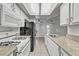 Functional kitchen with ample storage, modern appliances, and stone countertops, offering a practical cooking space at 2975 Bluegrass Ln # 811, Henderson, NV 89074