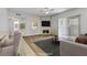 Spacious living room featuring modern decor, fireplace, and access to outdoor space at 2975 Bluegrass Ln # 811, Henderson, NV 89074